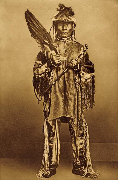 Chief KalkalshuatashPhotographed in native dress during a Nez Perce delegation to Washington, D.C. in 1868, Chief Kalkalshuatash holds a feather fan and pipe. After meeting with the government to restore the provisions of an 1863 treaty, his people still fell victim to funds squandered by government officials.– Courtesy Smithsonian Institution Bureau of American Ethnology –
