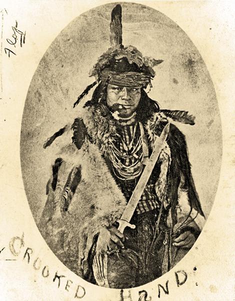 Crooked HandDespite a palsied hand, Crooked Hand, a Pawnee, gained notoriety as the “greatest warrior in the tribe,” anthropologist George Bird Grinnell reported. His son, Dog Chief, went on to serve as a U.S. Indian scout in the 1870s. This photo of Crooked Hand was taken circa 1870, three years before the warrior died.– Courtesy Smithsonian Institution Bureau of American Ethnology –