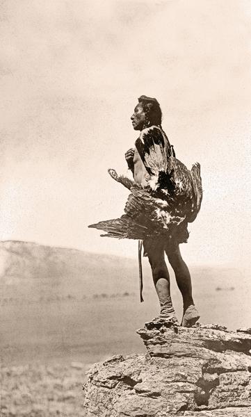Eagle CatcherThis powerful view of a Hidatsa holding an eagle as he stands on a large rock overlooking a valley conveys why so many Edward S. Curtis photographs speak to us today.– Courtesy Library of Congress –