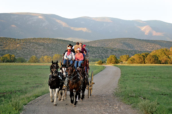 Traveling a New Mexico trail in the Rolls Royce of horse-drawn vehicles.