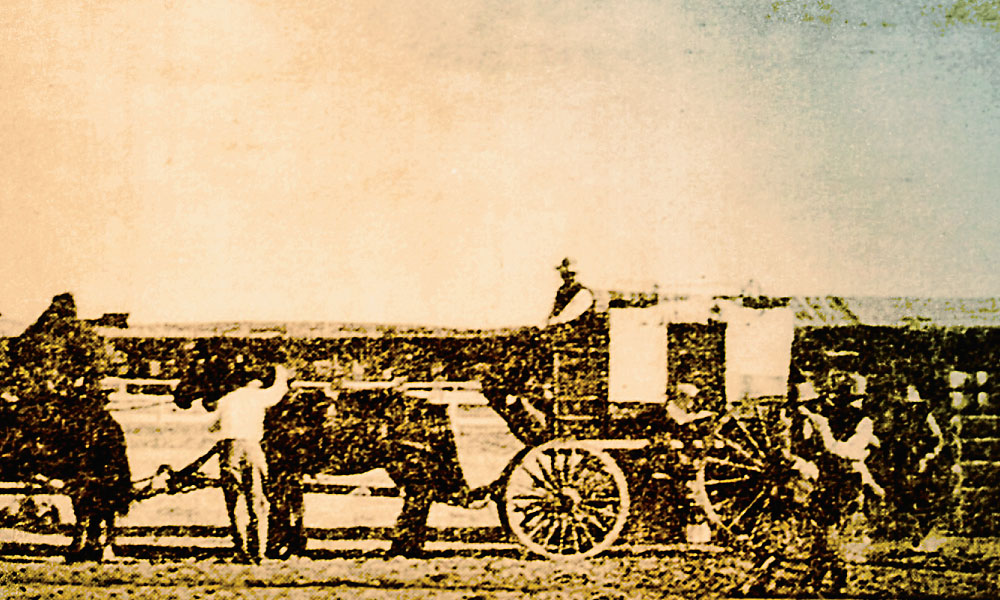 John C.H. Grabill’s circa 1887 “treasure coach” photo (inset) is too open to fit the description of the ironclad stage. A photo labeled “Treasure Coach at Canyon Springs 1878” (left) shows an open side door, barely revealing a man seated inside. The open door prevents us from seeing the porthole. The coach looks to have no windows though. Author Bill Markley thought this could be a photo of the Monitor, but stagecoach builder Doug Hansen dug up the truth: this photo was taken during a re-enactment of the Monitor holdup at the Wyoming State Fair in 1914. –Courtesy Homestake Adams Research and Cultural Center –