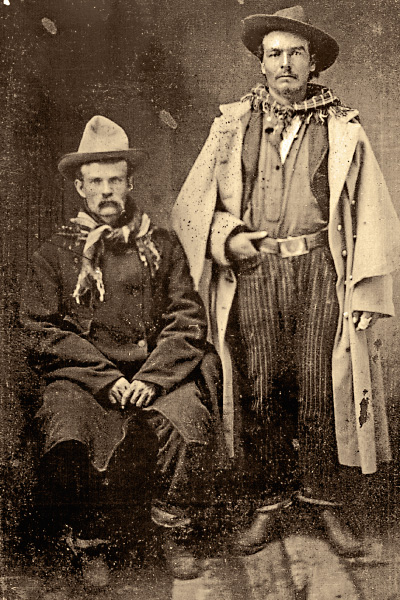 23 Definitive Drovers (Opposite Page) Working cowboys engaged in trailing longhorns to markets or to a new range, these drovers appear to date to the 1870s. They have not yet adopted traditional cowboy clothing and are wearing military frock coats, pinstriped pants and nondescript hats. The cowboy on the right held up his pants with a military belt and buckle. â Courtesy Robert G. McCubbin Collection â