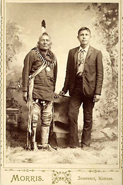 College student William Pollock stands next to his stepfather, Big Eagle, for support as his father had passed away by then. – Courtesy Cowan’s Auctions, May 20-21, 2004 –