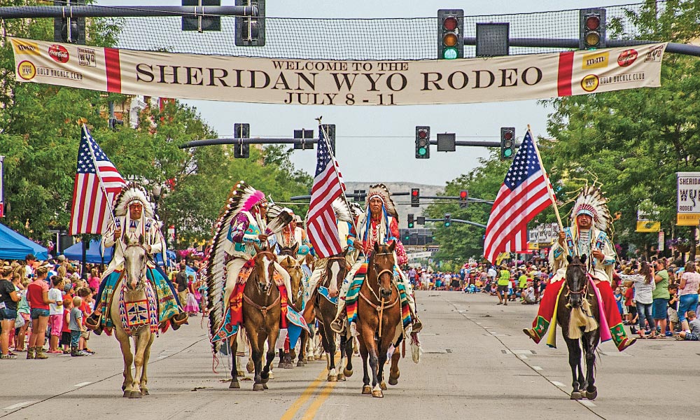 Local Crow and Cheyenne Indian tribal members have been participants in the Sheridan WYO Rodeo since it was founded in 1931. The Sheridan WYO Rodeo Parade will roll down Main Street on Friday morning of the week-long event, July 11-17, 2016. – Courtesy Sheridan Travel & Tourism –