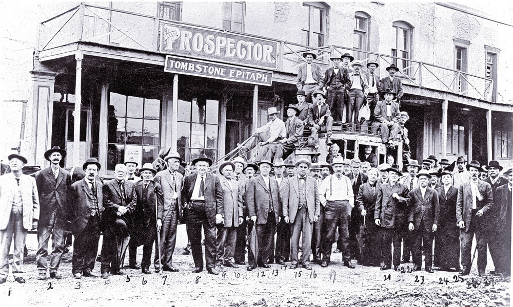 In this circa 1912 photo, Jim Young stands near the rear of the stagecoach, with a group of other citizens of Tombstone, Arizona. He was a local fixture in Cochise County, well into the 1930s. – Courtesy Arizona Historical Society –