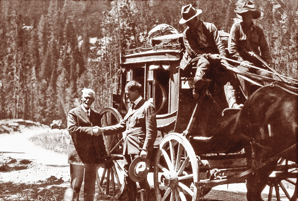 US_Charles-W--Cook-shaking-hands-with-Yellowstone-National-Park-superintendent-Horace-Albright-during-the-1922-Golden-Anniversary-celebration_scaled