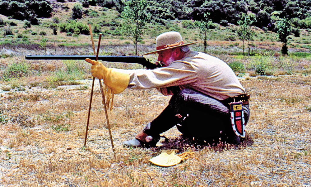 Cross-sticks were often nothing more than a pair of thin, but stout wooden sticks, about 36 inches long, tied together at the appropriate spot so the rifle’s barrel could be rested in the crotch of this setup, securing a steady shot. Here, Spangenberger uses cross-sticks to get a steady shot with a custom Lone Star Rifle Co. (now defunct) Remington Rolling Block rifle. – Courtesy Phil Spangenberger Collection –